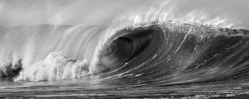 a huge wave in greyscale.